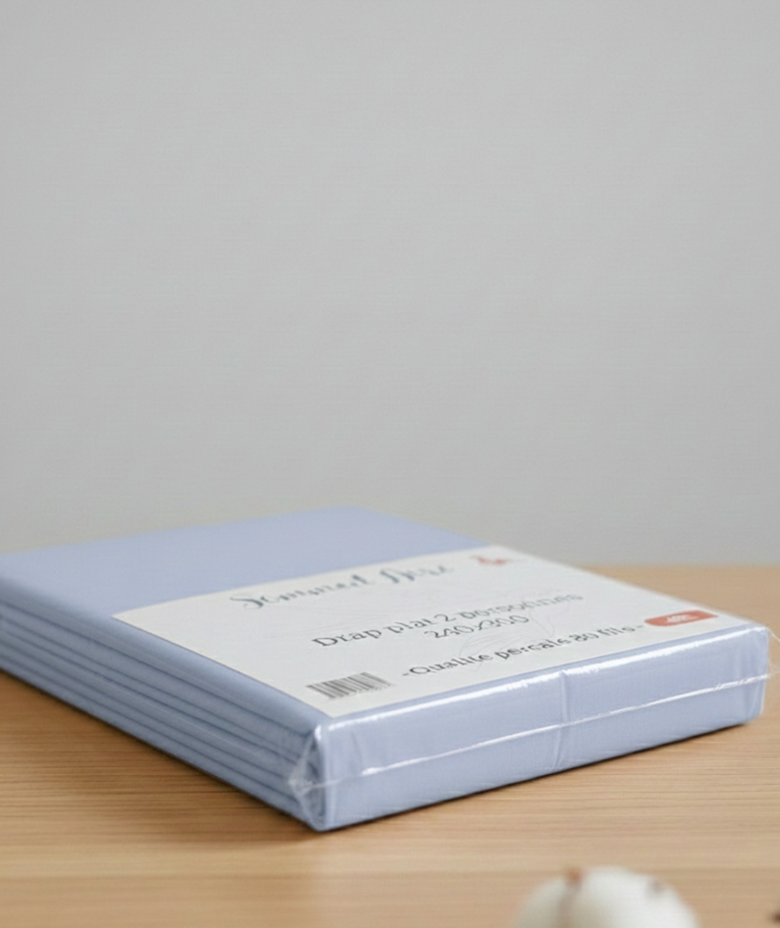 Drap plat bleu clair 2 personnes – percale 80 fils, vue latérale de l’emballage