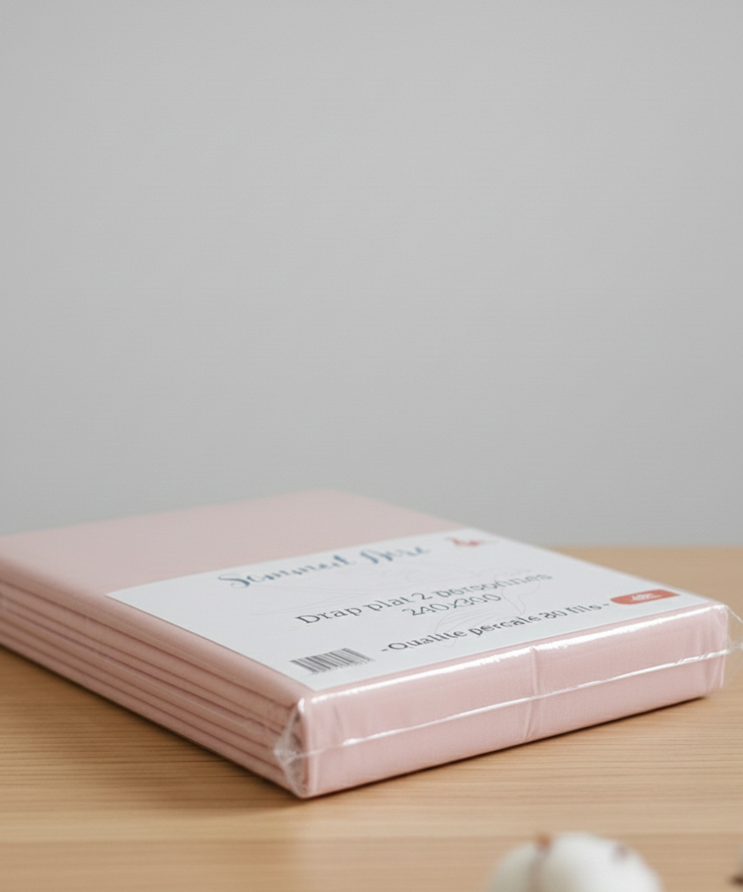 Vue latérale de l’emballage d’un drap plat rose 80 fils en percale