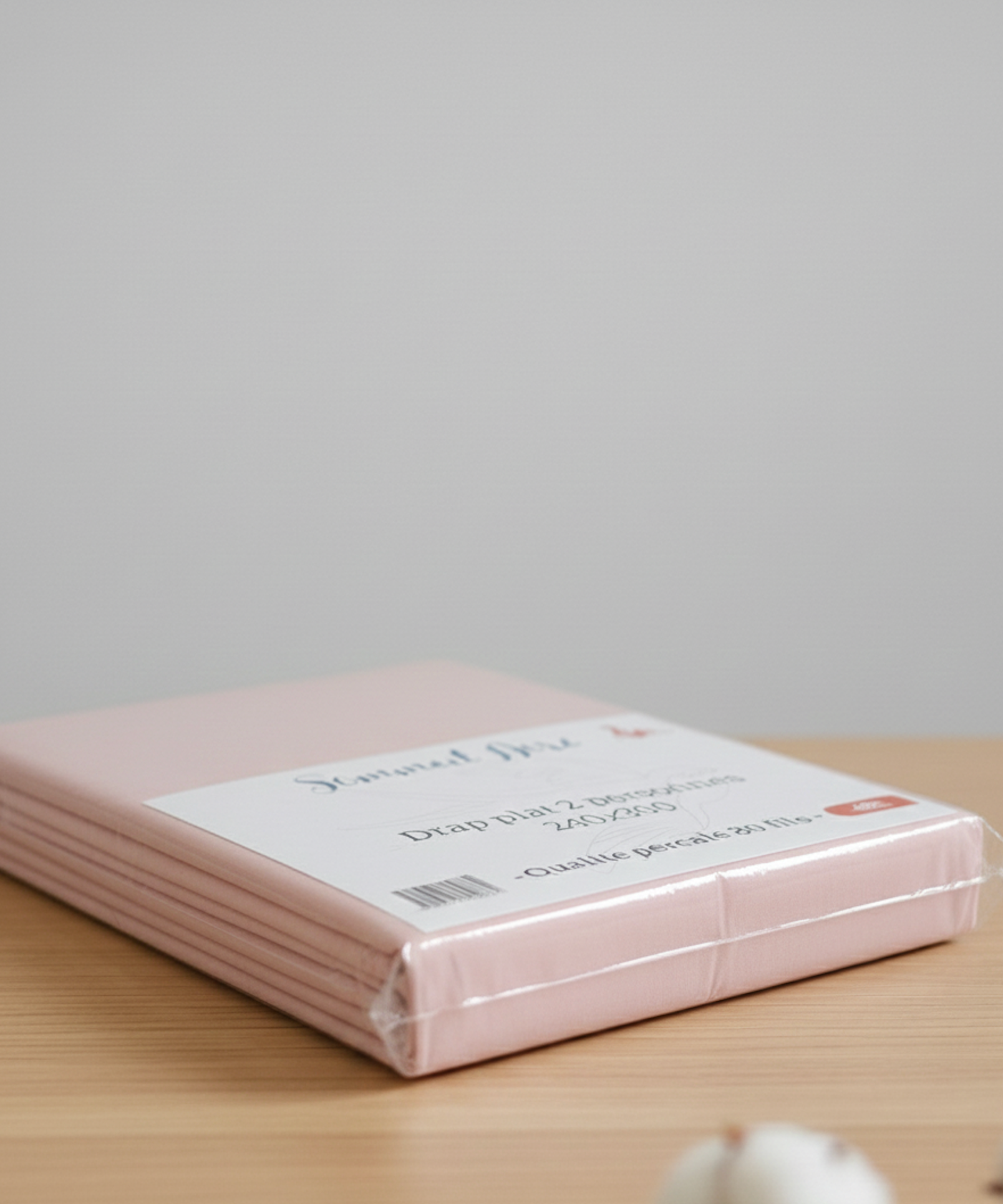 Vue latérale de l’emballage d’un drap plat rose 80 fils en percale